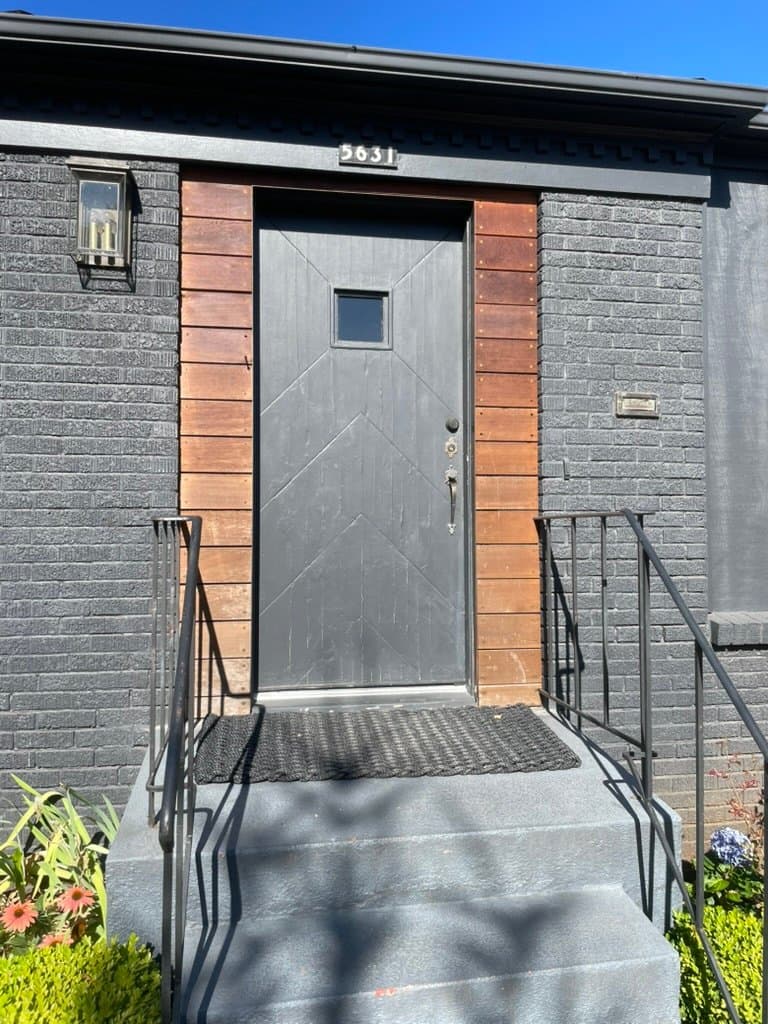 Modern entry door with cedar surround installed by Powell’s Doors & Windows in Portland